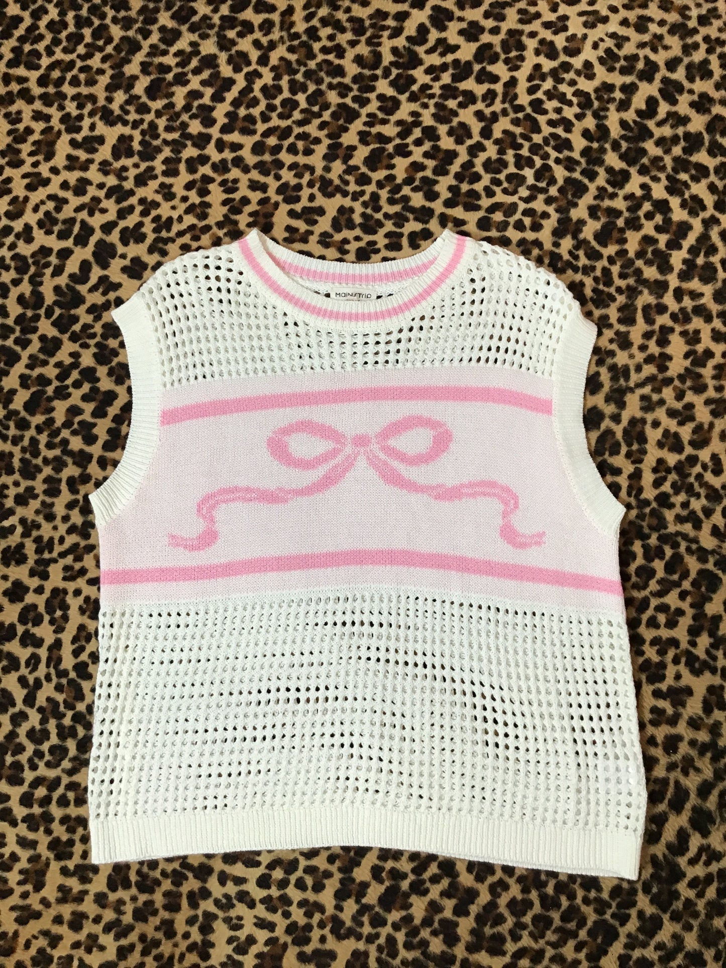 Pink and white bow vest